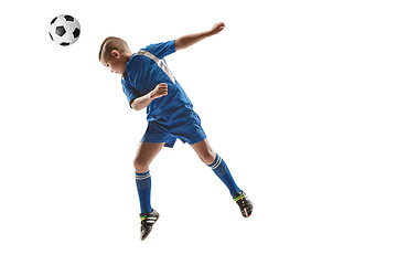 Image showing Young boy with soccer ball doing flying kick