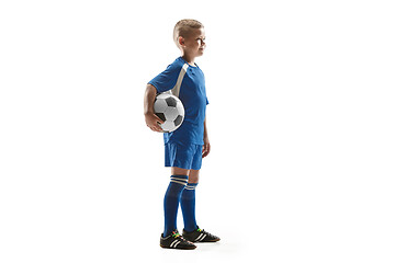 Image showing Young fit boy with soccer ball standing isolated on white