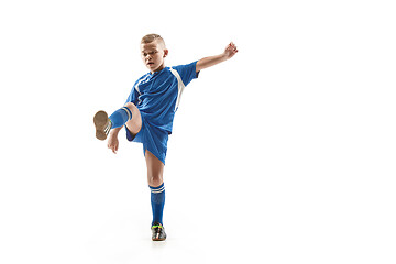 Image showing Young boy with soccer ball doing flying kick