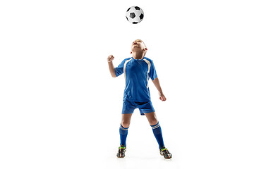 Image showing Young boy with soccer ball doing flying kick