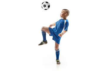 Image showing Young boy with soccer ball doing flying kick