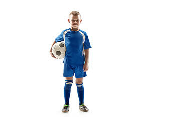 Image showing Young fit boy with soccer ball standing isolated on white