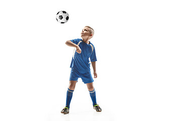 Image showing Young boy with soccer ball doing flying kick