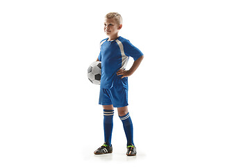 Image showing Young fit boy with soccer ball standing isolated on white