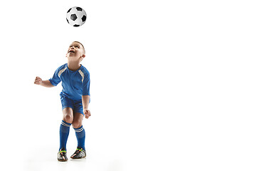 Image showing Young boy with soccer ball doing flying kick