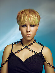 Image showing Close-up indoor portrait of lovely girl with blonde hair. Studio shot of graceful young woman with short haircut