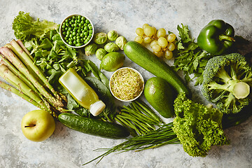 Image showing Green antioxidant organic vegetables, fruits and herbs placed on gray stone