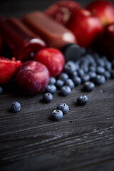 Image showing Mix of fresh red and black fruits. With botteled fresh juices