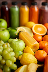 Image showing Colorful bottles filled with fresh fruit and vegetable juice or smoothie