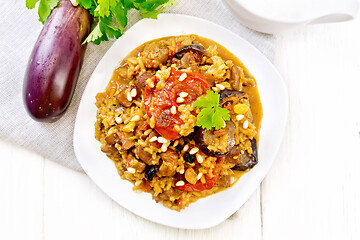 Image showing Rice with vegetables and chicken in plate on board top