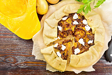 Image showing Pie with pumpkin and onions on dark board top