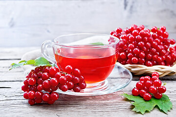 Image showing Tea from viburnum in cup on board