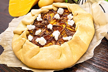 Image showing Pie with pumpkin and onions on parchment