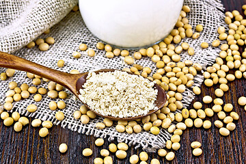 Image showing Flour soy in spoon with soybeans on sacking