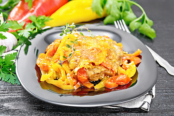 Image showing Chicken with pepper in plate on black board