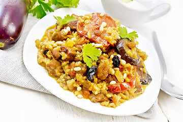 Image showing Rice with vegetables and chicken in plate on board