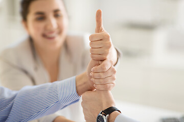 Image showing group of business team making thumbs up gesture