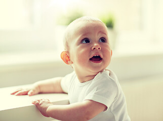 Image showing happy little baby boy or girl at home