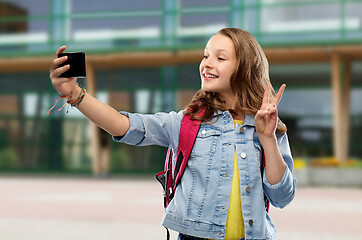 Image showing teenage student girl taking selfie by smartphone