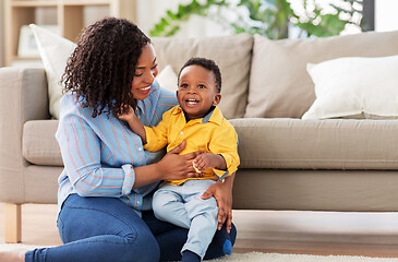 Image showing happy african american mother with baby at home