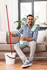 Image showing indian man with mop and detergent cleaning at home