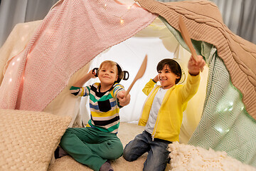 Image showing boys with pots playing in kids tent at home