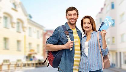 Image showing couple with air tickets, bags and passport in city