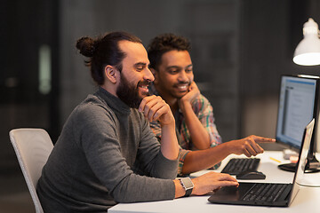 Image showing creative team with computer working late at office