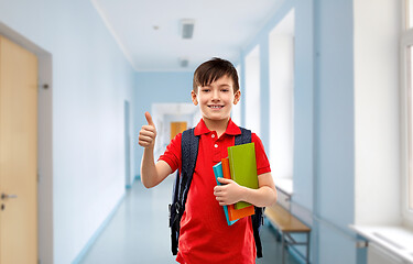 Image showing student boy with books and bag showing thumbs up