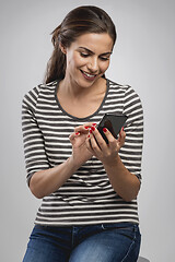 Image showing Texting someone