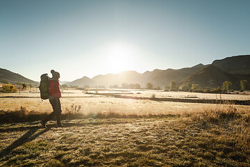 Image showing Woman walking with a backpack