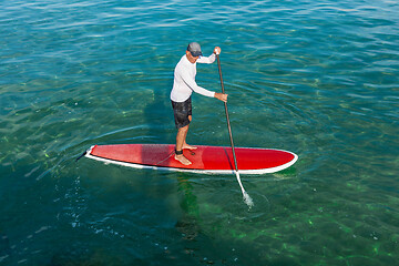 Image showing Senior man practicing paddle
