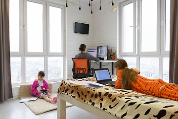 Image showing family deals on different gadgets in one room