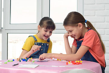 Image showing Two girls having fun playing a board game