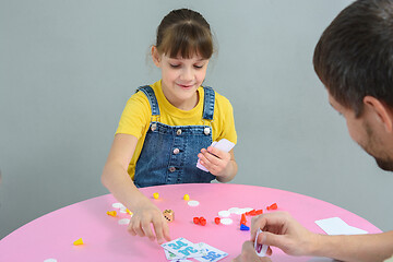 Image showing Girl playing card board games with dad