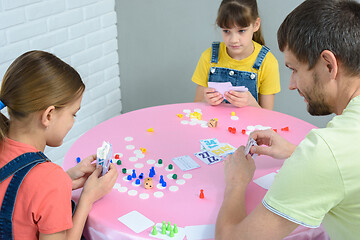 Image showing Family at the table plays card board games.