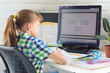 Image showing distance learning at home in front of a computer