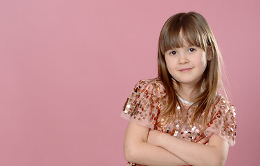 Image showing Close up shot of beautiful blonde Caucasian little girl wearing sequin dress