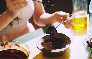 Image showing Staying at home woman preparing handmade vegetarian chocolate tr