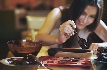 Image showing Staying at home woman preparing handmade vegetarian chocolate tr