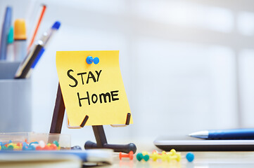 Image showing Stay Home text on adhesive note at the office