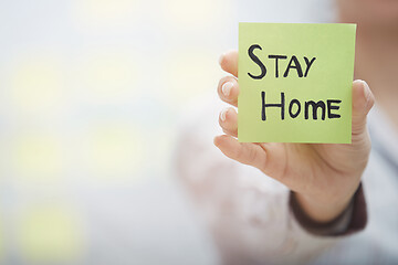 Image showing Hand holding sticky note with Stay Home text