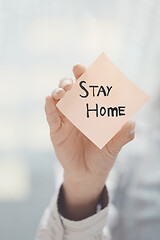 Image showing Hand holding sticky note with Stay Home text