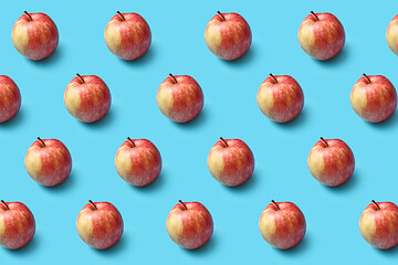 Image showing Fresh natural organic apples pattern on a blue background.