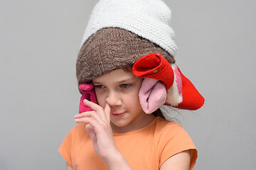 Image showing Girl picking her nose with a homemade funny hat