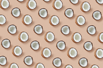 Image showing Horizontal pattern from natural tropical coconut\'s halves on a beige background.