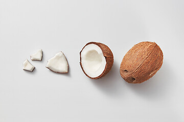 Image showing Set from fresh ripe natural organic coconut fruits on a light grey background.