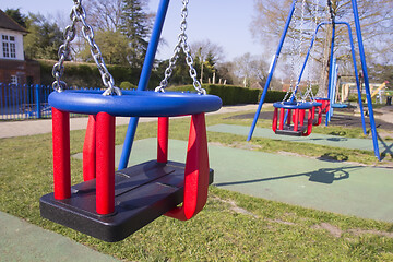 Image showing Empty swings in children's playground during lockdown