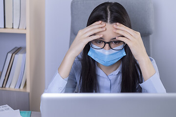 Image showing Exhausted businesswoman working during the coronavirus pandemic