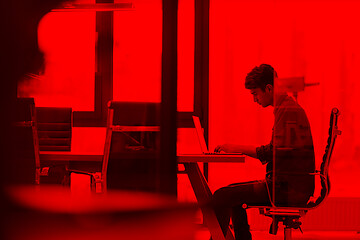 Image showing businessman working using a laptop in startup office